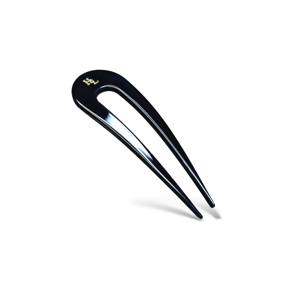 Black acetate french hair pin with gold logo detail
