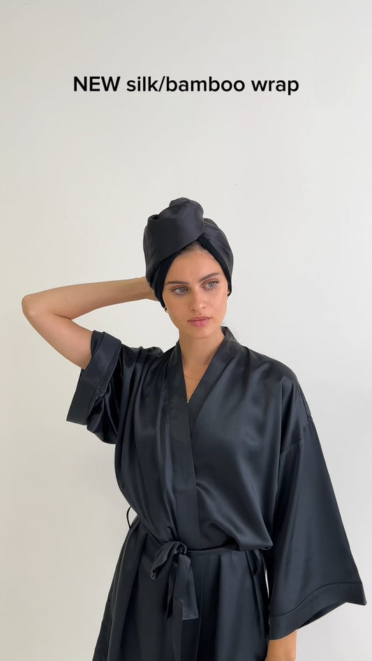 Model wearing black silk kimono robe and hair wrap