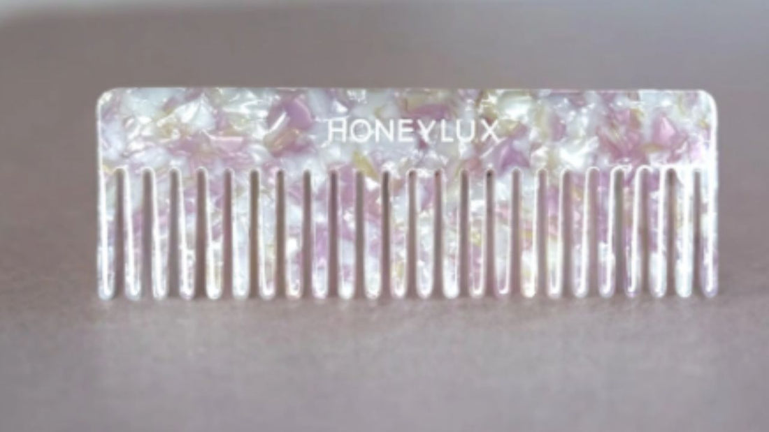 An acetate detangling comb available at HoneyLux